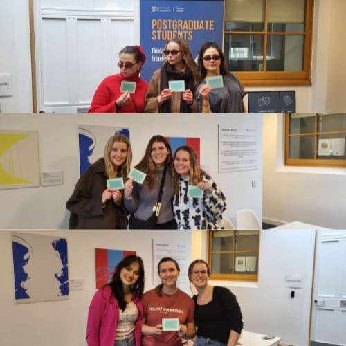 students holding up scavenger hunt prizes